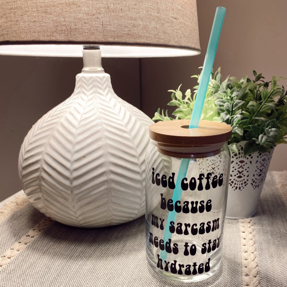 Glass can with bamboo lid and straw